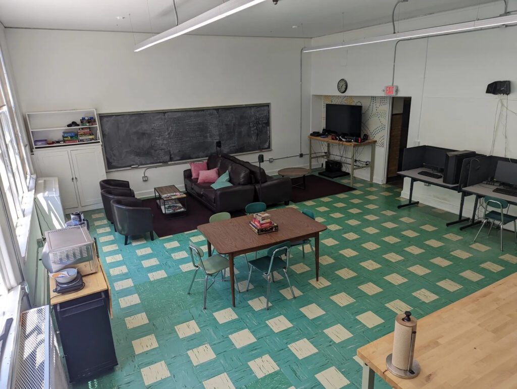 BRIC kitchen and break area with seating, video games, and a toaster oven