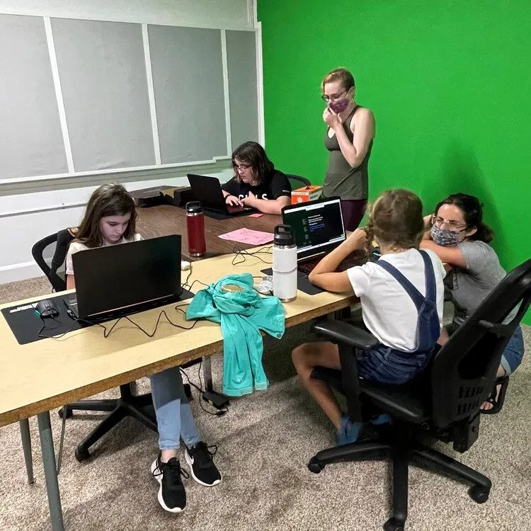 Students learning to code at a coding league
